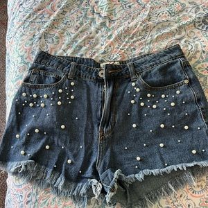Jean shorts with pearls just on the front.